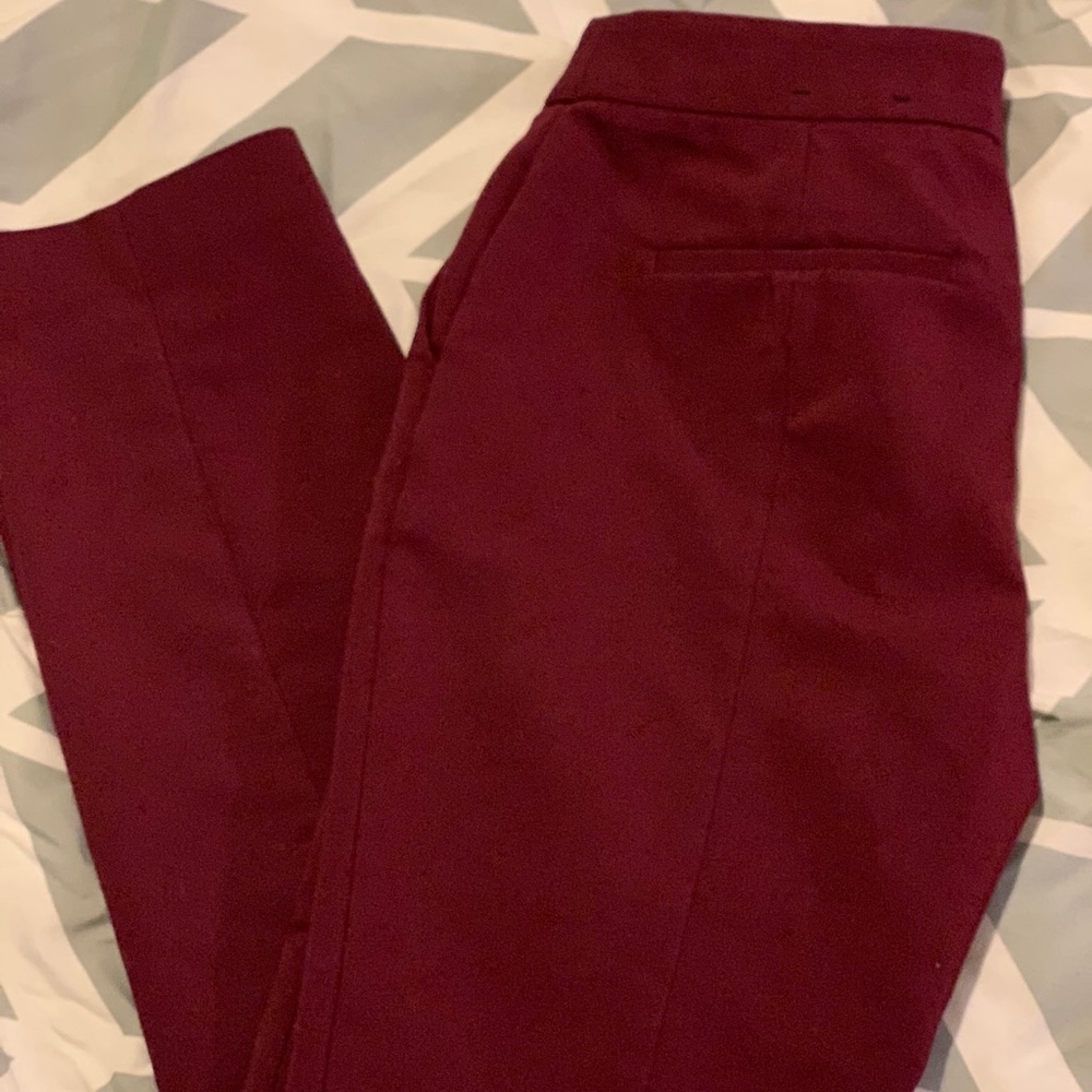 Maroon colored dress pants, skinny leg